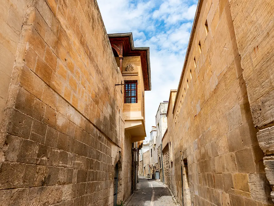 Narrow stone alleyway with steps, a shaded detour between trail days.