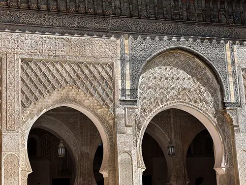 Grand doorway and horseshoe arches.
