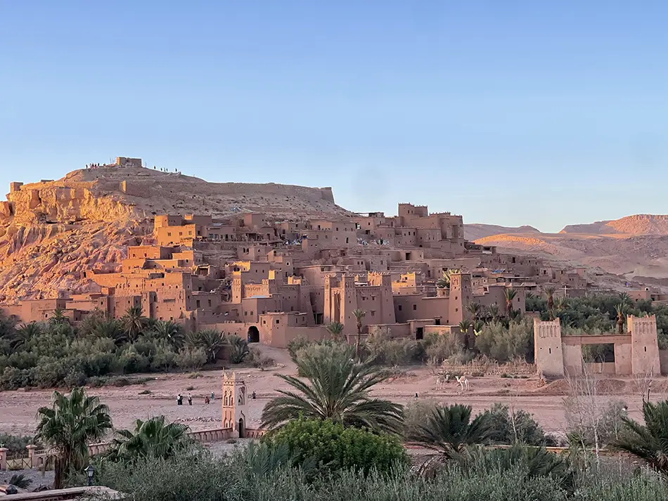 Sunlit adobe kasbahs of Ait Ben Haddou, one of the best movie locations for travelers.