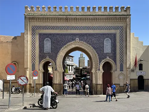 Crowds pass through Bab Bou Jeloud, a landmark among Top Attractions in Fes.