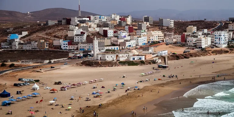 Coastal cliffs and whitewashed houses overlooking the Atlantic near Mirleft.