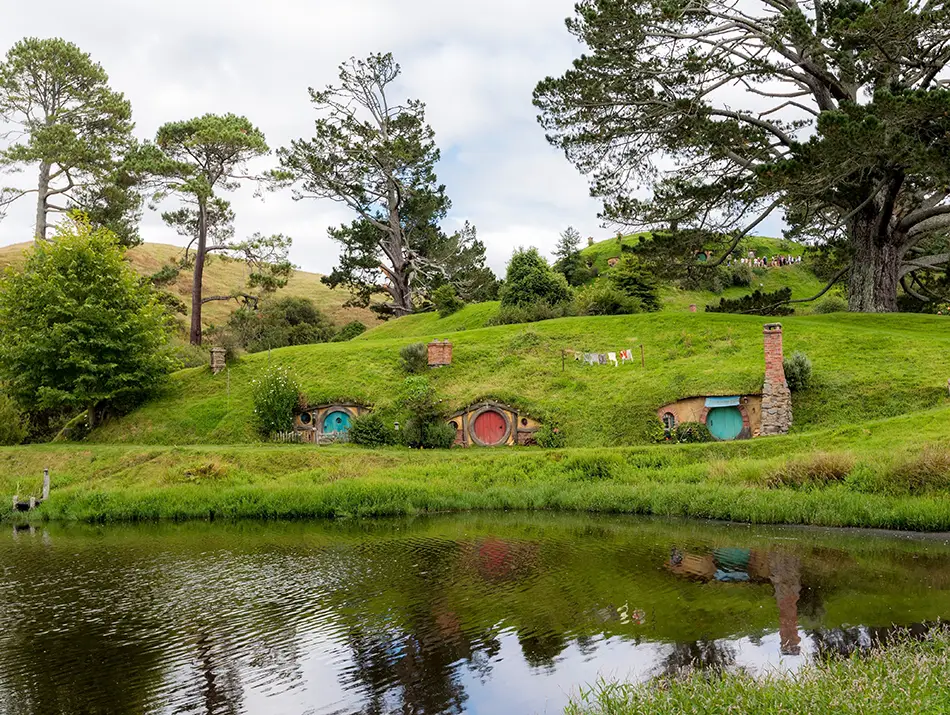 Lush Shire gardens at Hobbiton, one of the best movie locations for travelers.