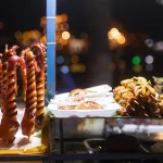 Seafood skewers and grill setup, typical of best food in Mui Ne after dark.