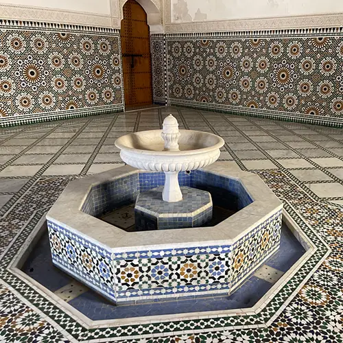 Geometric tiled fountain in Moulay Ismail Mausoleum courtyard, one of the Things to see in Meknes.