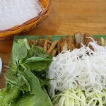 Rice noodles with herbs and dipping sauce, vegetarian food in mui ne.