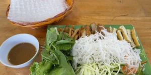 Rice noodles with herbs and dipping sauce, vegetarian food in mui ne.