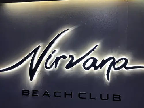 Neon Nirwana sign glowing near the entrance to a nightclub 