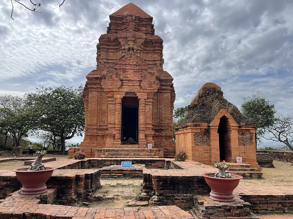 Front of main brick sanctuary at Poshanu Towers with doorway and base platform
