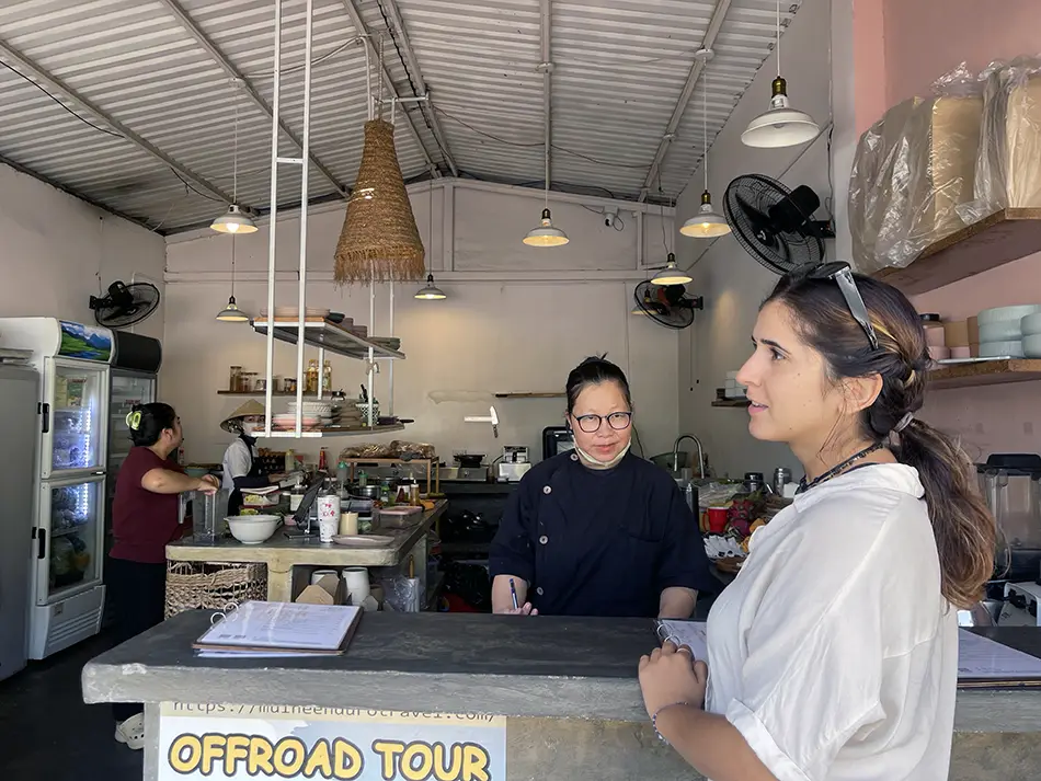 Traveler placing an order at Feed Your Soul vegetarian restaurant in Mui Ne.