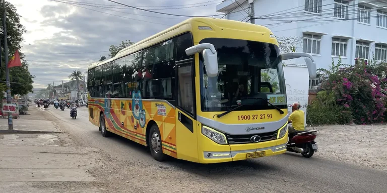 Sleeper bus arriving in Mui Ne tourist area after traveling from Ho Chi Minh City