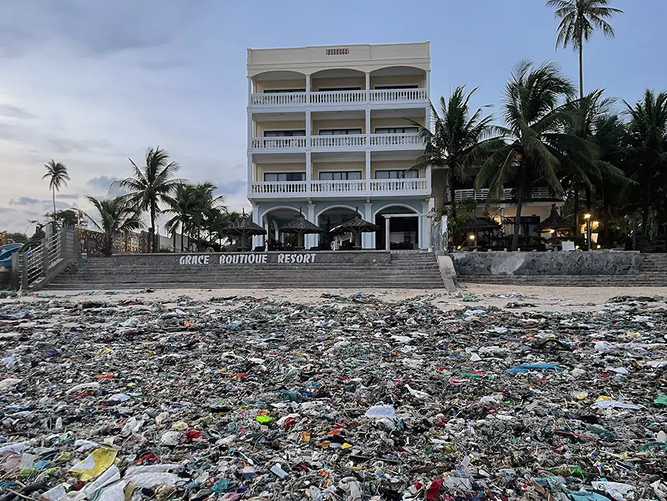 Mui Ne beach covered in plastic waste after waves showing downside of visiting Mui Ne, Vietnam