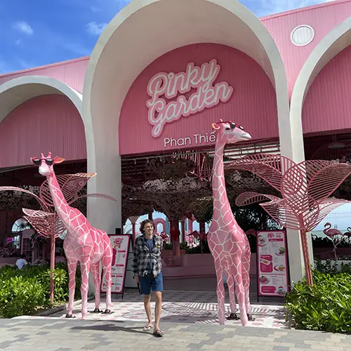 Pink roadside café with giraffe statues along the Mui Ne to Ke Ga road.