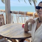 Guides and Stories travel team member on an oceanview terrace exploring the best places to eat in Mui Ne.