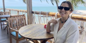 Guides and Stories travel team member on an oceanview terrace exploring the best places to eat in Mui Ne.