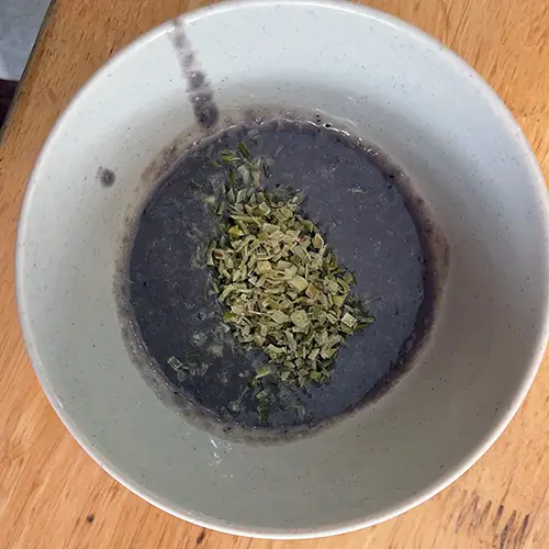 Small bowl of fermented shrimp paste.