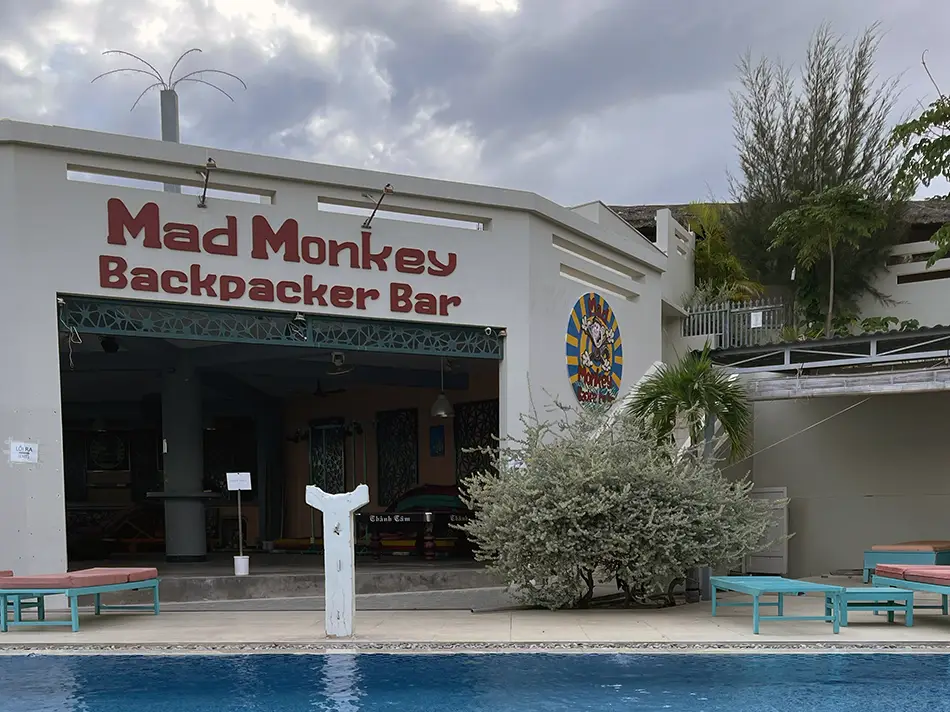 An empty swimming pool area at Mui Ne Hills hostel
