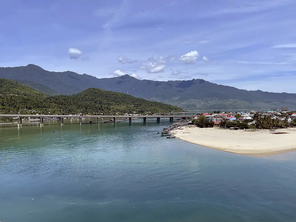 View of a bridge and lagoon while descending the Hai Van Pass toward Hue.