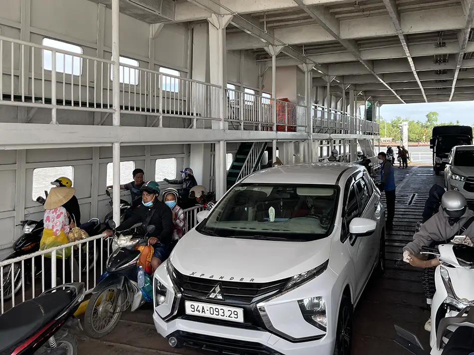 Ferry transporting cars and motorbike in Mekong Delta