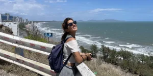 Traveler at a railed viewpoint above the Vung Tau coastline.