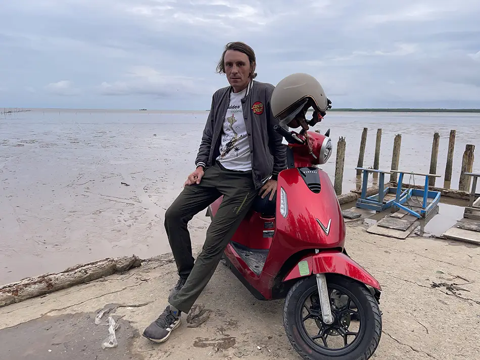 Traveler with a motorbike in Mekong Delta