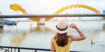 tourist-looking-at-dragon-bridge-danang-vietnam